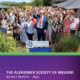 Cover of the Alzheimer Society of Ireland Impact Report 2025 featuring a celebratory image taken at the launch of a sensory garden in Co. Sligo, with staff, people living with dementia, family carers, community members and public representatives